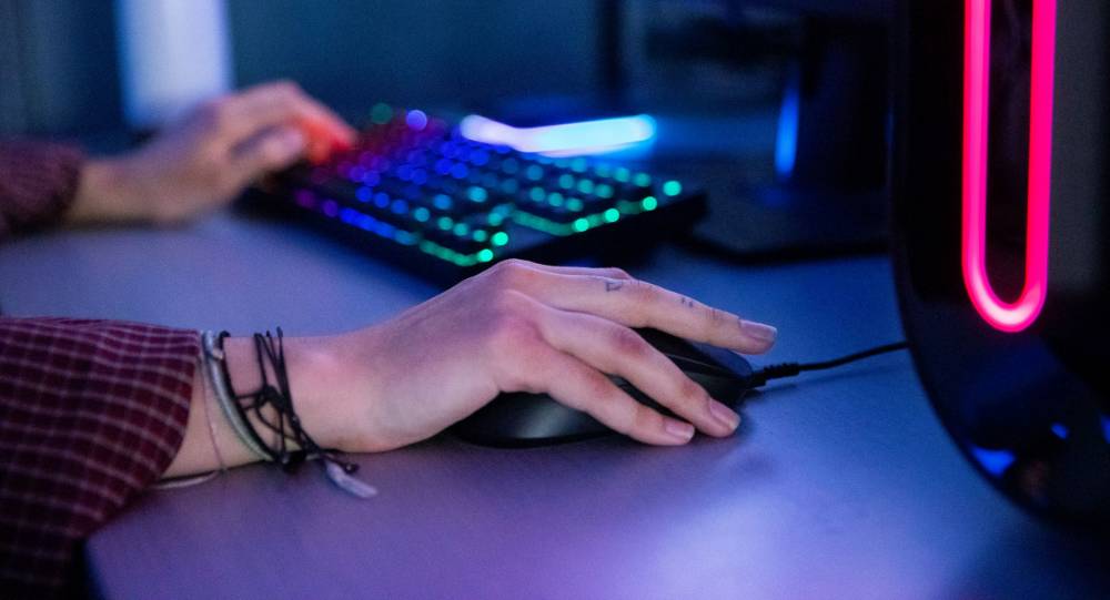 Person using a computer mouse and keyboard